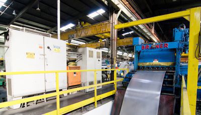 photo of Riverside warehouse machinery processing steel